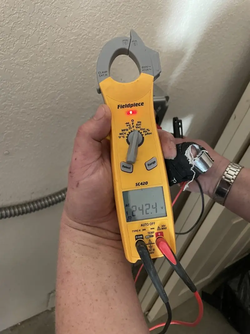 Voltage testing with clamp meter during Electrical Installation Services in Seaford